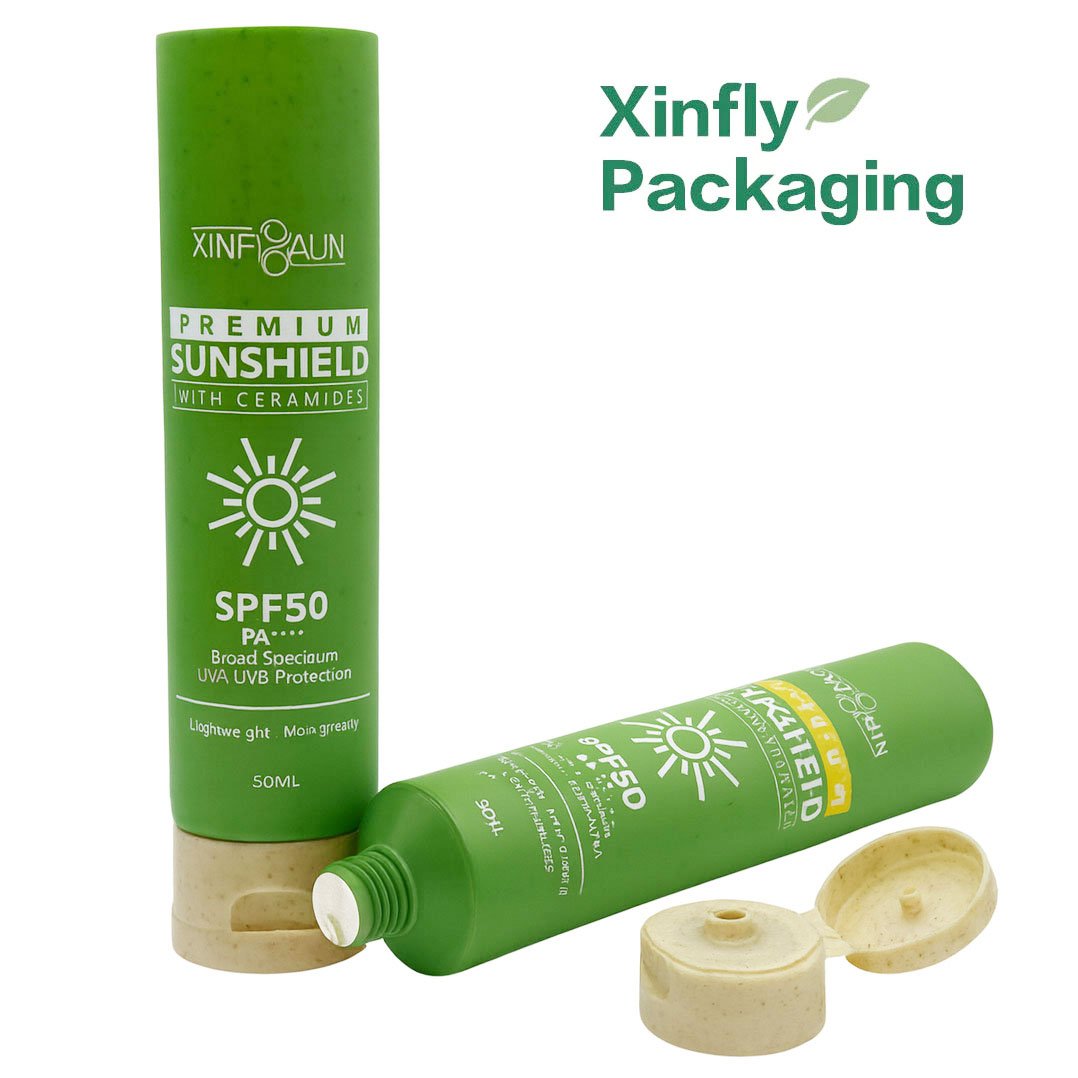 Eco-friendly 50ml wheat straw plastic sunscreen tube with flip cap by Xinfly Packaging — sustainable cosmetic packaging for SPF 50 skincare and sunblock products.