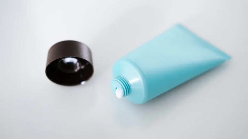What materials are commonly used in cosmetic tube packaging